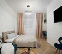Master bedroom with online smart TV connected with kichten corner