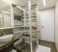 Bathroom includes of large bath, shower, toilet, washbasin and huge LED mirror. Towels and soup is included.