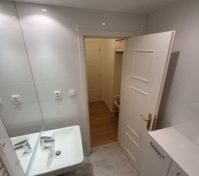 The bathroom with shower and toilet